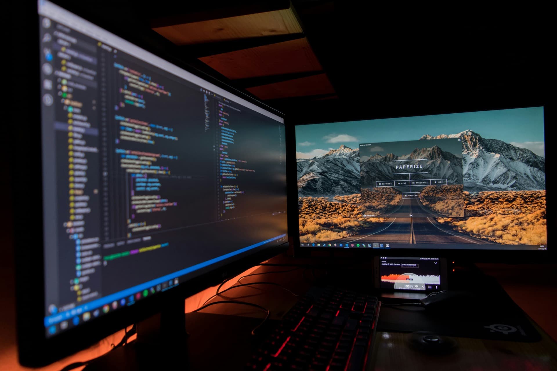 Engineer working in a dark, monitor-lit development environment